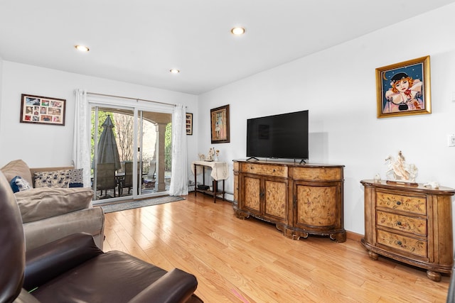 living room with recessed lighting and light wood-style floors