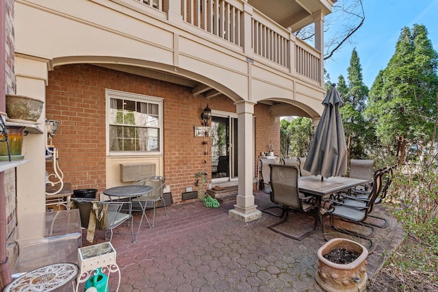 view of patio / terrace featuring outdoor dining area and a balcony