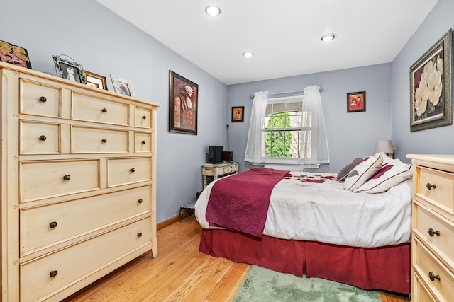 bedroom featuring recessed lighting, light wood-style flooring, and baseboards