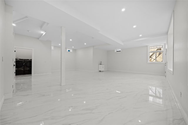48 Moore St, New Hyde Park, NY 11040 - below grade area with washing machine and dryer, light marble finish floors, and recessed lighting