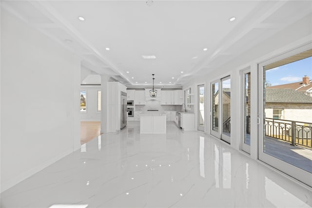 48 Moore St, New Hyde Park, NY 11040 - unfurnished living room with recessed lighting and light marble finish floors