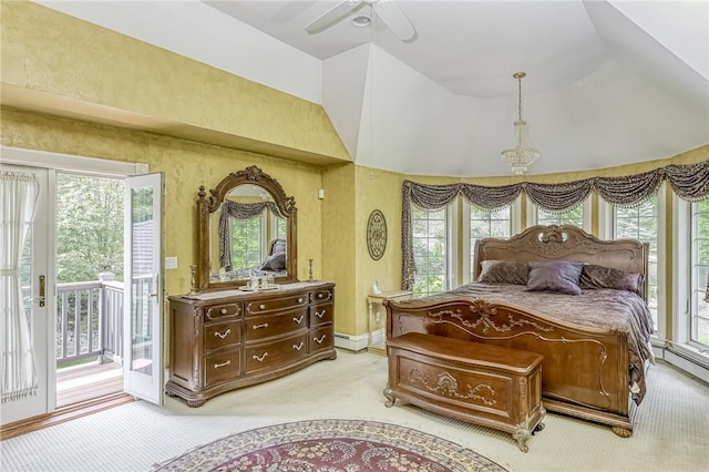 bedroom featuring multiple windows, light colored carpet, vaulted ceiling, and access to outside