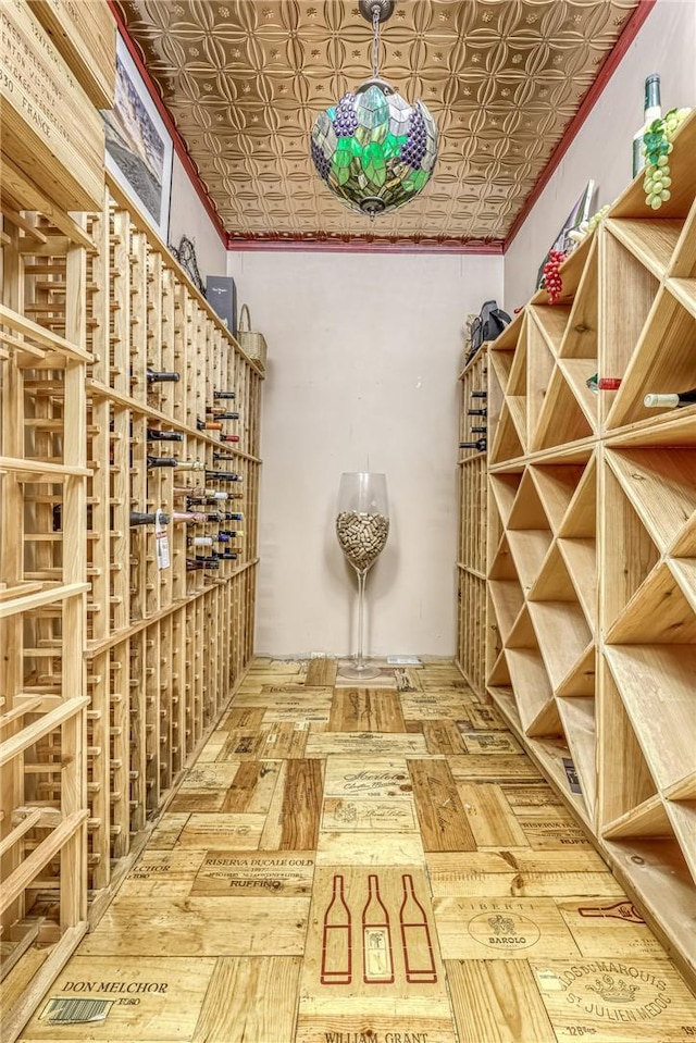 wine area with an ornate ceiling and crown molding