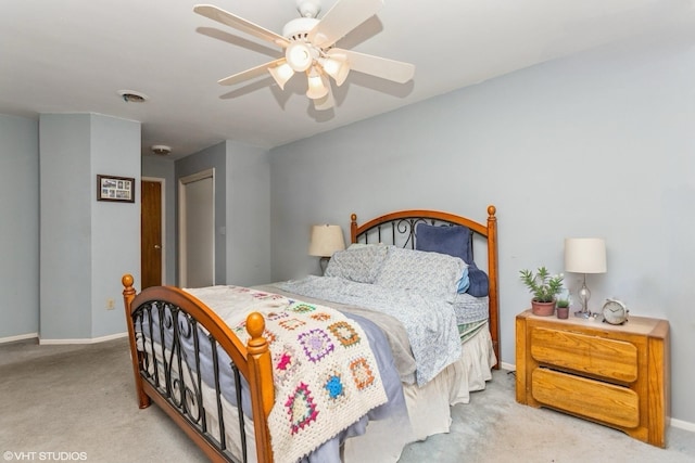 carpeted bedroom with visible vents, baseboards, a closet, and a ceiling fan