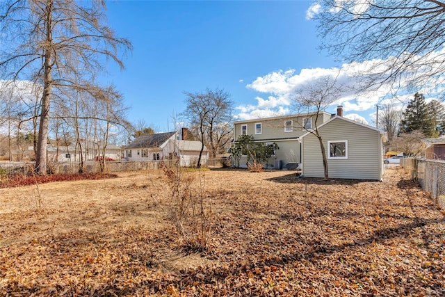 back of property with fence