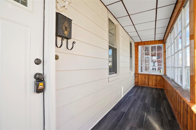 unfurnished sunroom with a paneled ceiling