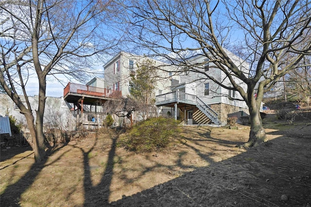 view of yard featuring stairs and a deck