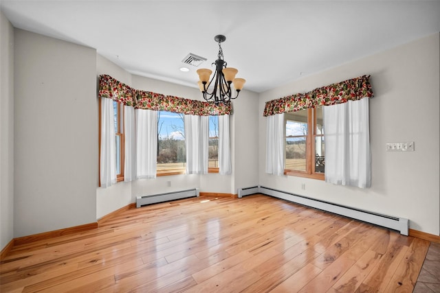 unfurnished room with hardwood / wood-style floors, visible vents, a chandelier, and a baseboard radiator