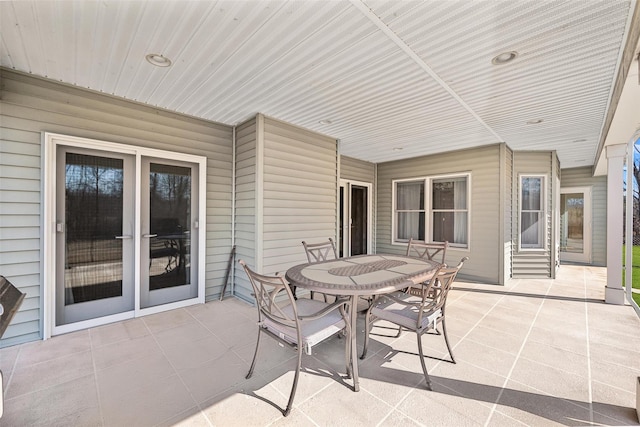 view of patio featuring outdoor dining area