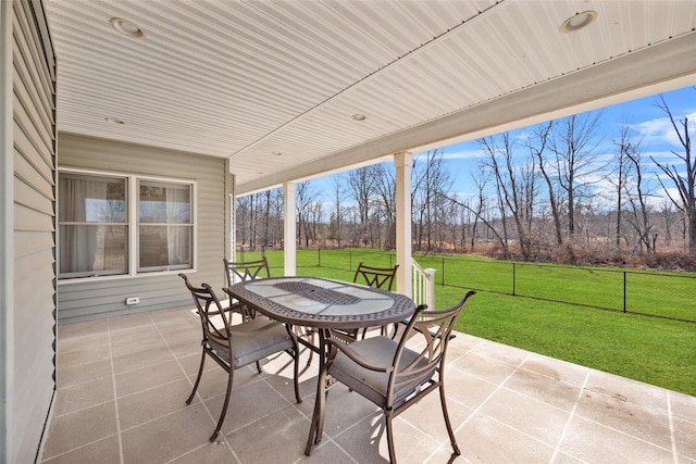 view of patio / terrace featuring outdoor dining area and fence