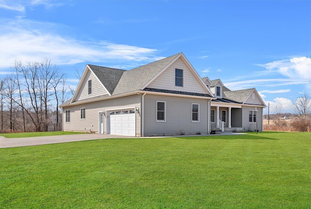 exterior space with an attached garage, concrete driveway, a front lawn, and roof with shingles