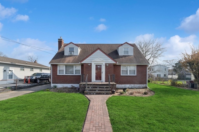 16 Pine Rd, North Amityville, NY 11701 - cape cod home featuring brick siding, fence, a chimney, and a front yard