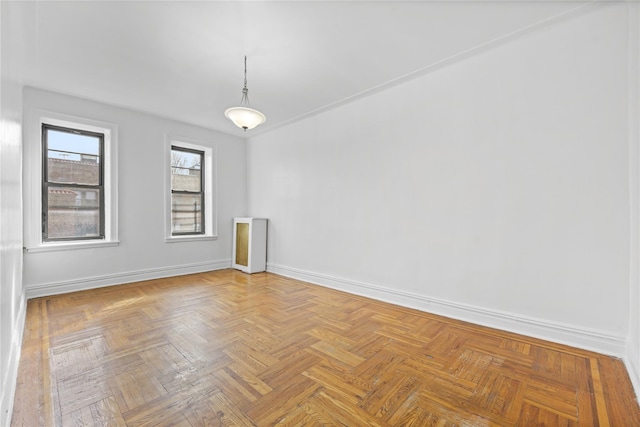 empty room with baseboards