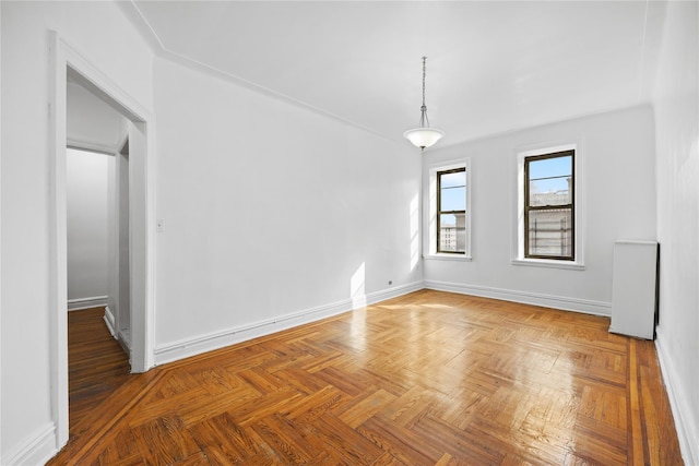 unfurnished room featuring baseboards