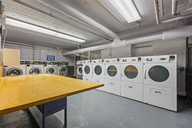 community laundry room featuring washing machine and clothes dryer