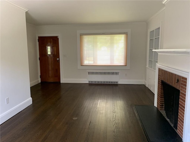 unfurnished living room with radiator, crown molding, baseboards, dark wood finished floors, and a fireplace