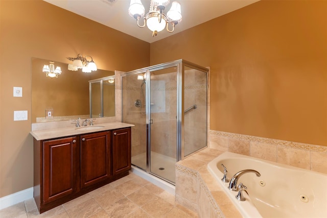 bathroom featuring a notable chandelier, a shower stall, vanity, and a tub with jets