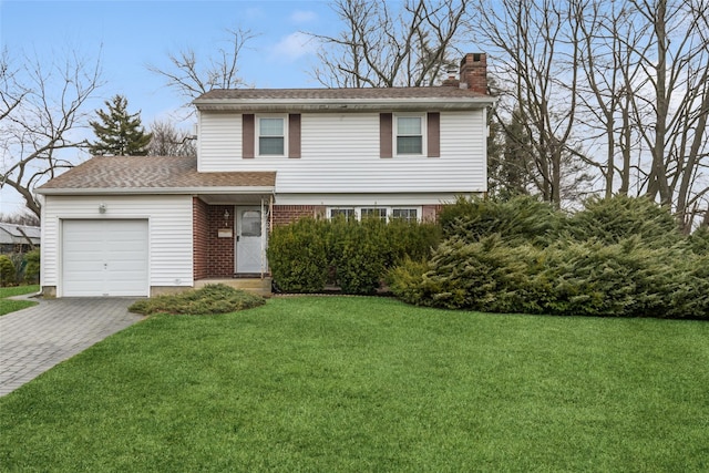 view of front of property featuring driveway, roof with shingles, a chimney, a front lawn, and a garage