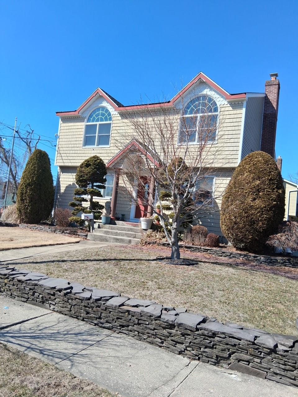 view of front facade with a chimney