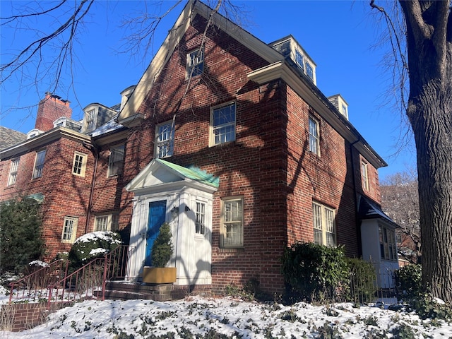 view of front of home with brick siding