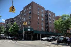 view of building exterior with uncovered parking