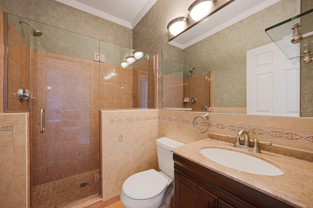 full bath with tile walls, toilet, crown molding, vanity, and a stall shower