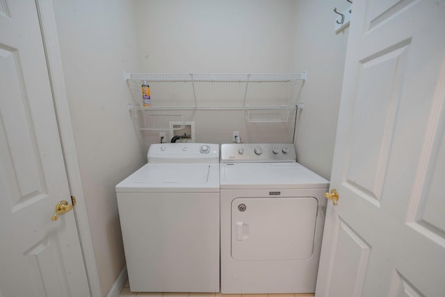 laundry area with laundry area and separate washer and dryer