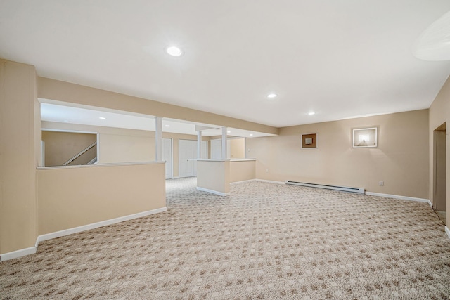 finished basement with a baseboard radiator, baseboards, carpet, and recessed lighting
