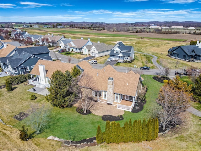 birds eye view of property with a residential view