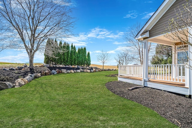 view of yard with covered porch