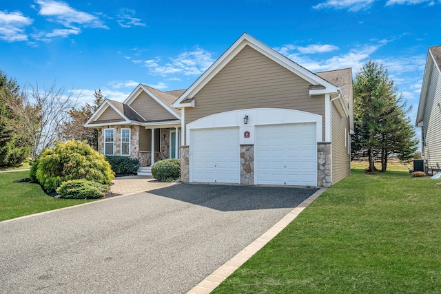 view of front facade featuring an attached garage, aphalt driveway, stone siding, and a front lawn
