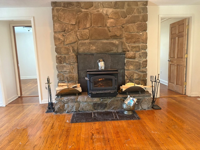 interior details with baseboards and wood finished floors