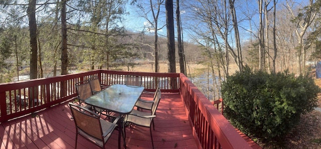 wooden deck featuring outdoor dining space