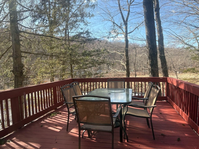 wooden deck with outdoor dining area