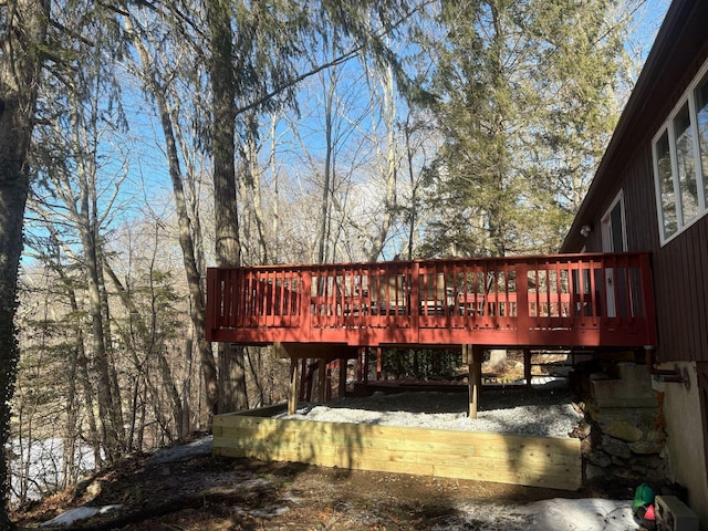 back of property featuring a wooden deck