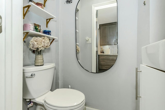 half bath featuring toilet