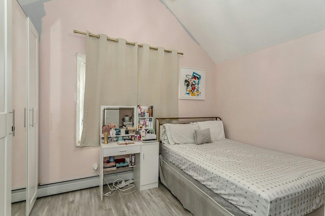 bedroom featuring light wood-type flooring, lofted ceiling, and a baseboard radiator