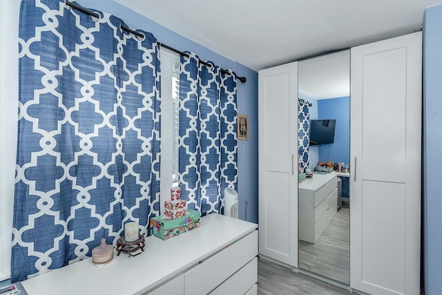 bathroom featuring wood finished floors