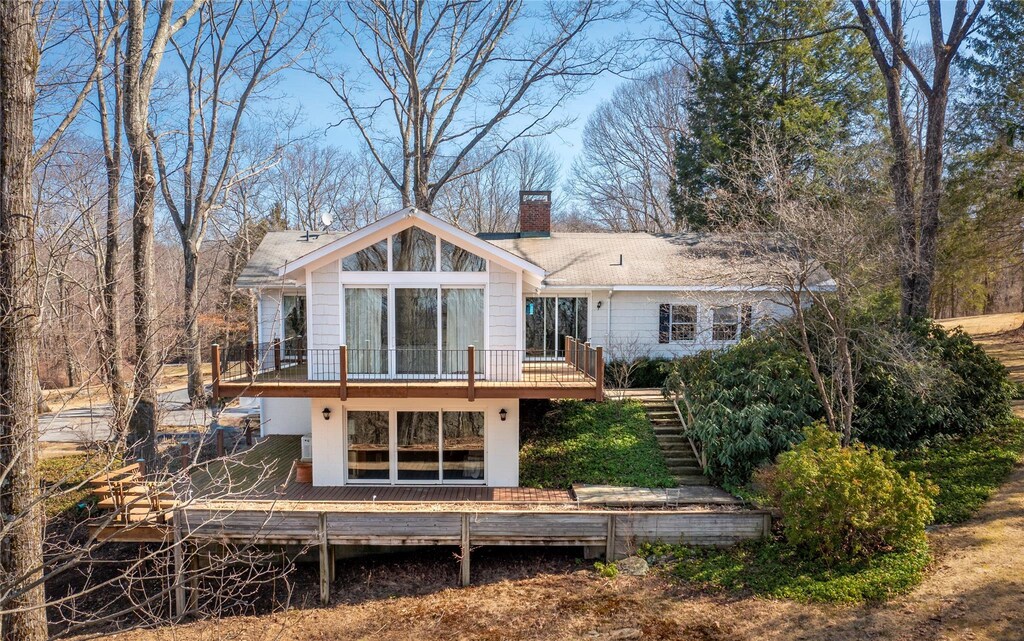 12 Berry Ln, Pawling, NY 12564 - back of house with a chimney, a deck, and stairway