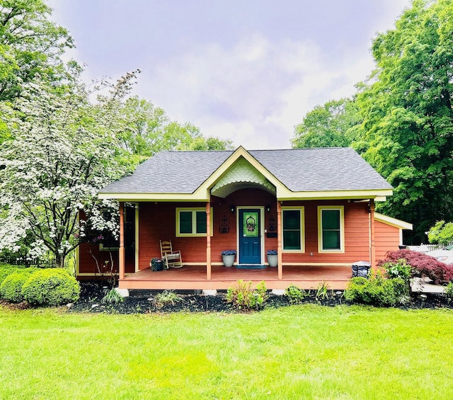 23 Antonelli Ct, Bloomingburg, NY 12721 - view of front facade with a porch, roof with shingles, and a front yard