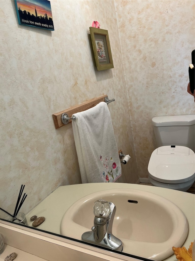 half bathroom featuring toilet