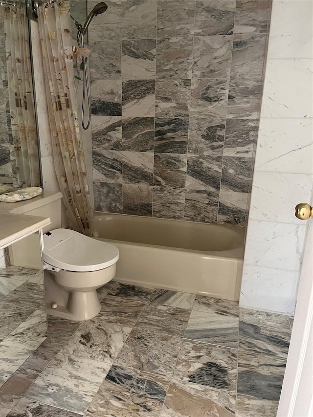 bathroom with toilet and shower / bathing tub combination