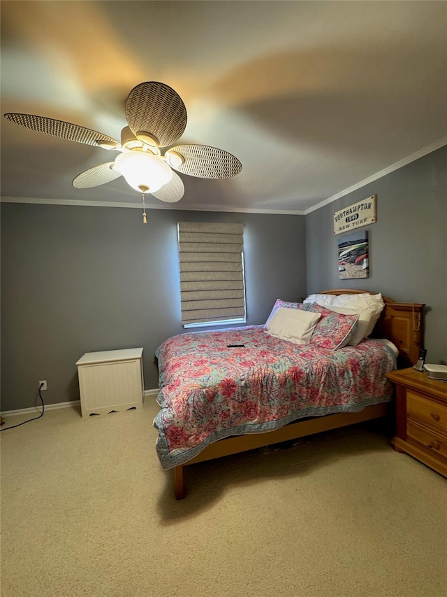 bedroom featuring ceiling fan, baseboards, carpet floors, and ornamental molding