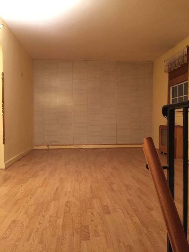 unfurnished room with light wood-type flooring