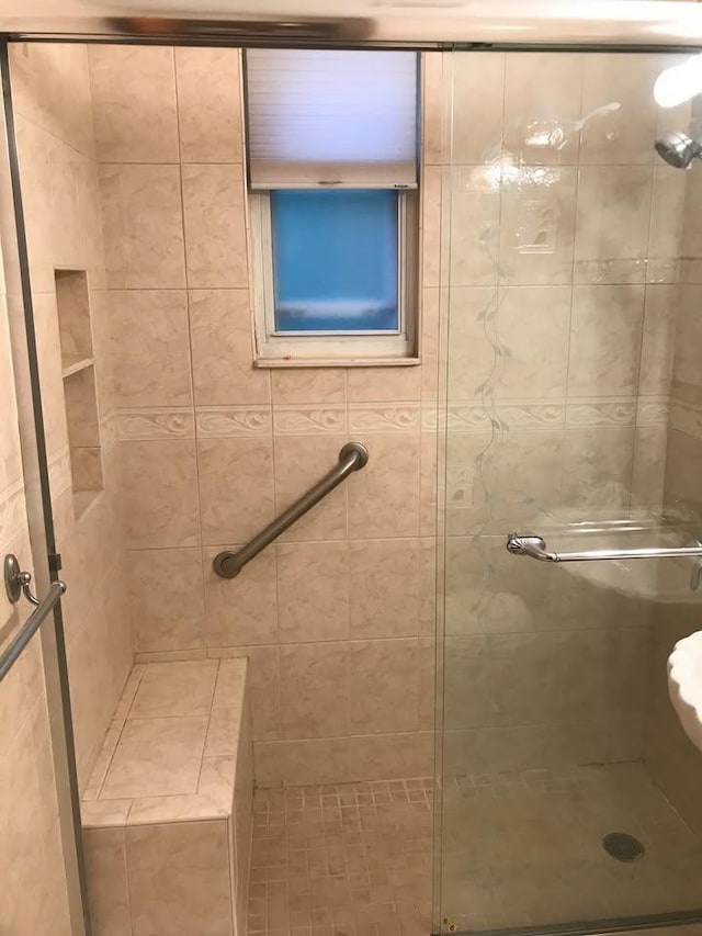 bathroom featuring a stall shower