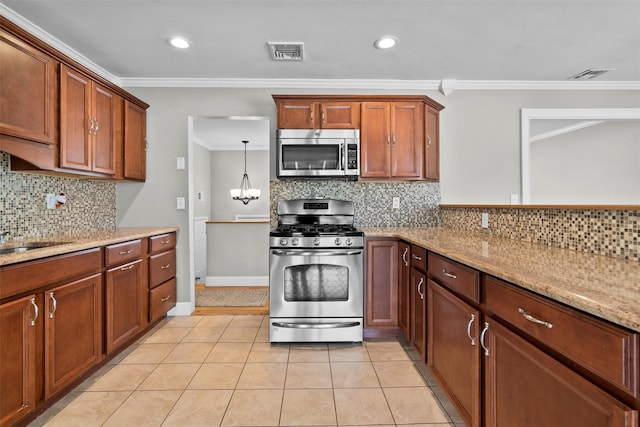 kitchen with crown molding, light tile patterned floors, visible vents, light stone countertops, and appliances with stainless steel finishes