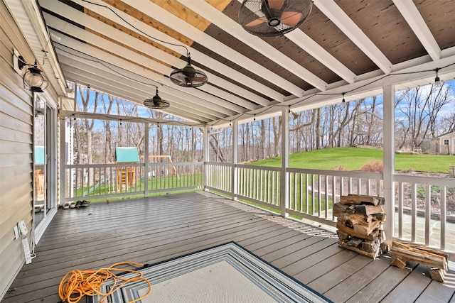 deck with a lawn and a ceiling fan