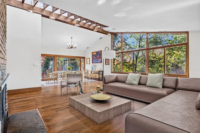 714 Ladd Rd, Bronx, NY 10471 - living room with a chandelier, wood finished floors, and a fireplace with flush hearth