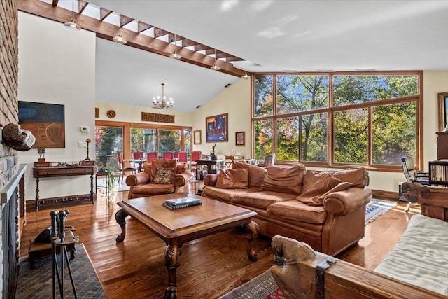 714 Ladd Rd, Bronx, NY 10471 - living room featuring a chandelier, wood finished floors, and a fireplace