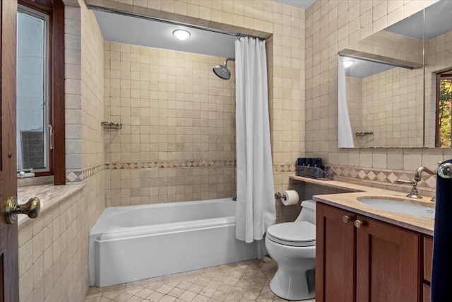 714 Ladd Rd, Bronx, NY 10471 - full bath with tile walls, tile patterned flooring, shower / bath combo, vanity, and tasteful backsplash